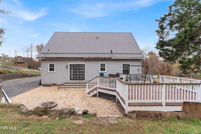 back of property featuring a deck