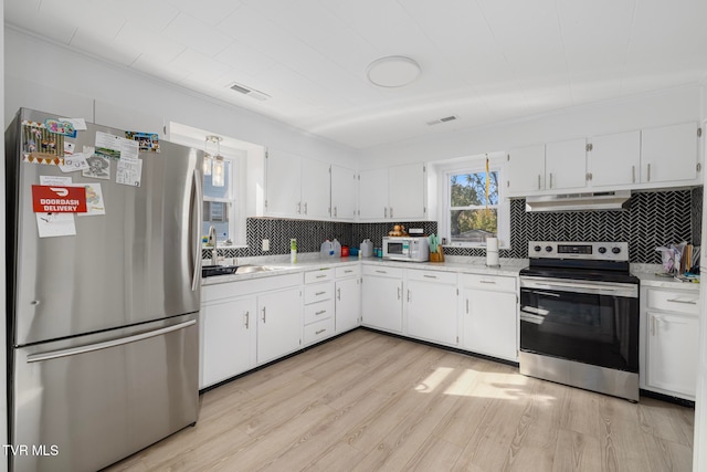 kitchen with white cabinets, stainless steel appliances, and sink