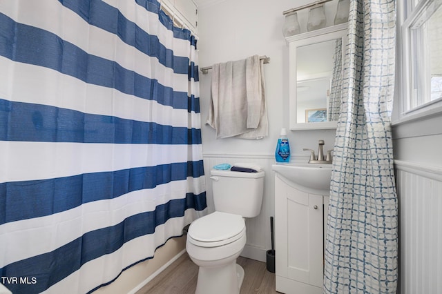 bathroom with a shower with curtain, vanity, toilet, and wood-type flooring