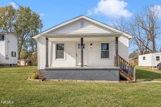 view of front of home with a porch and a front yard