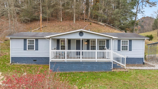 ranch-style house featuring covered porch