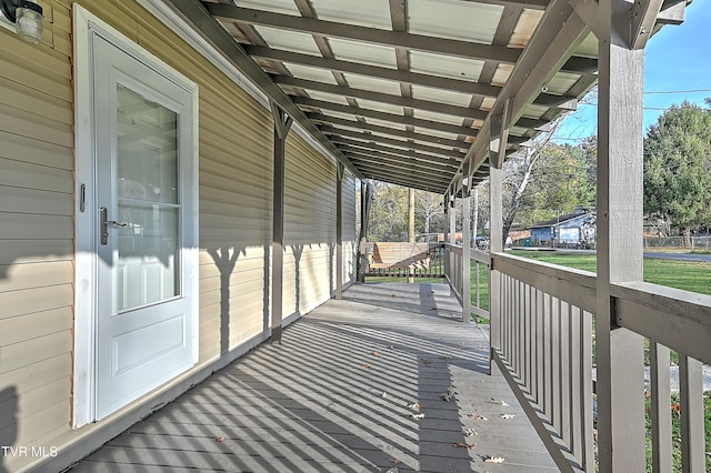 wooden terrace featuring covered porch