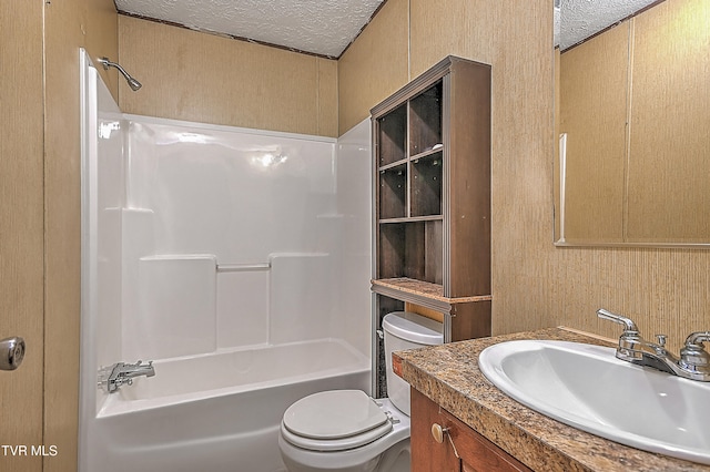 full bathroom with toilet, shower / tub combination, vanity, and a textured ceiling