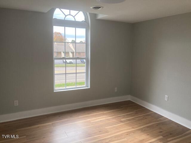 spare room with light wood-type flooring