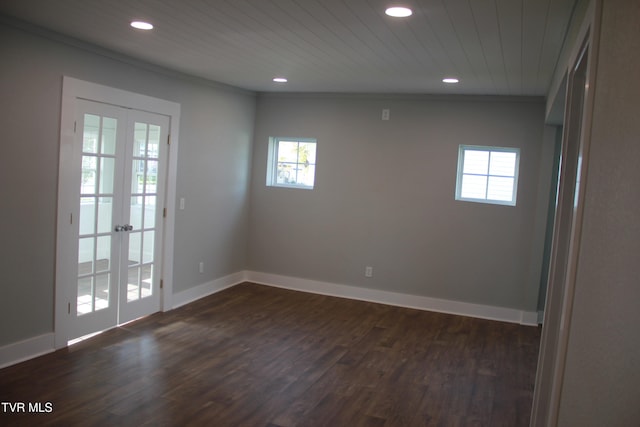 empty room with french doors, dark hardwood / wood-style floors, lofted ceiling, and wood ceiling