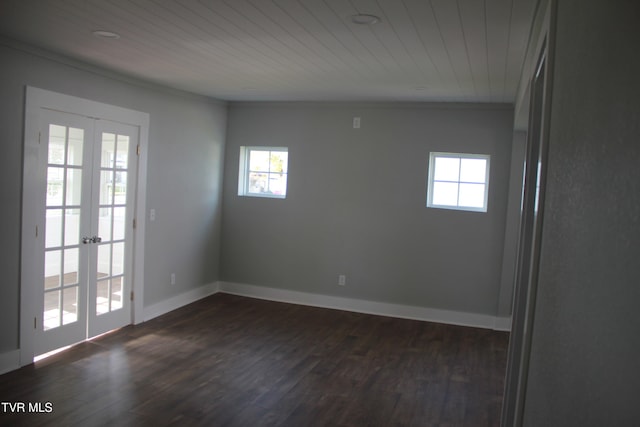 unfurnished room featuring dark hardwood / wood-style flooring, wood ceiling, and french doors