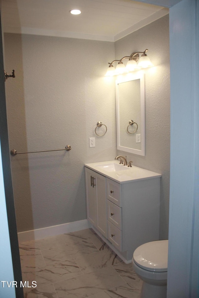 bathroom with vanity and toilet