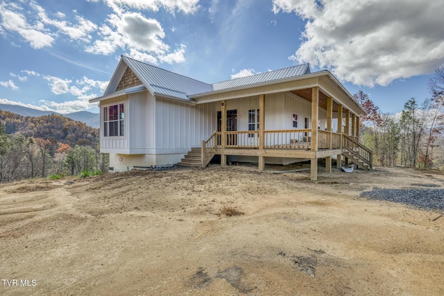 view of front of home featuring a mountain view and a porch