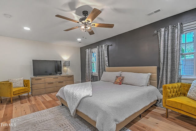 bedroom featuring light hardwood / wood-style flooring and ceiling fan