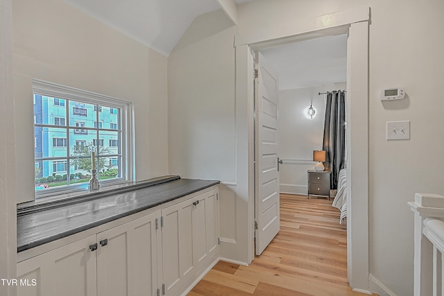 interior space with light hardwood / wood-style flooring and white cabinets