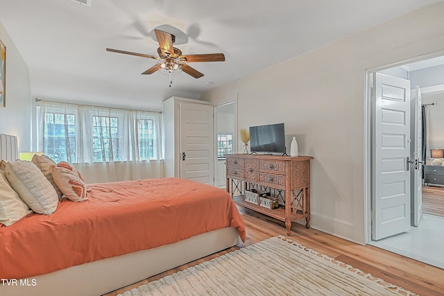 bedroom featuring ceiling fan and light hardwood / wood-style floors