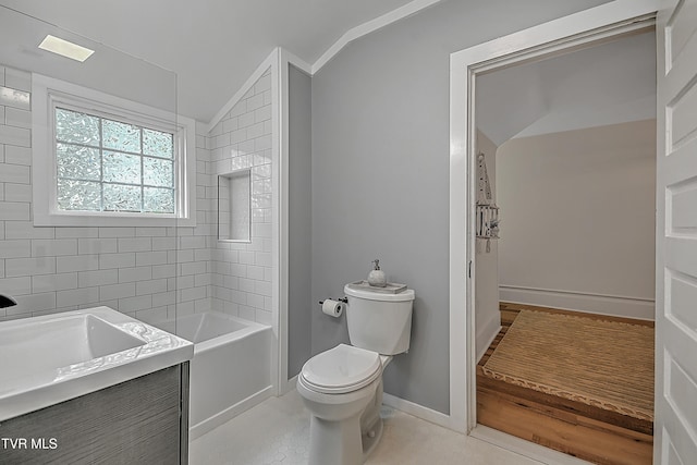 full bathroom with vanity, tiled shower / bath combo, vaulted ceiling, and toilet