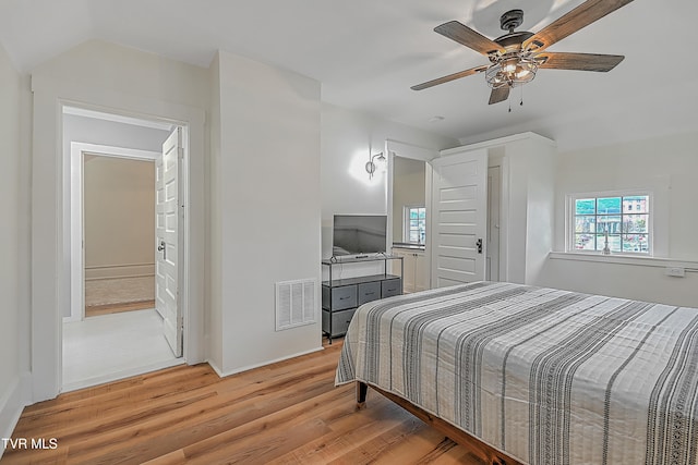 bedroom with ceiling fan and light hardwood / wood-style floors