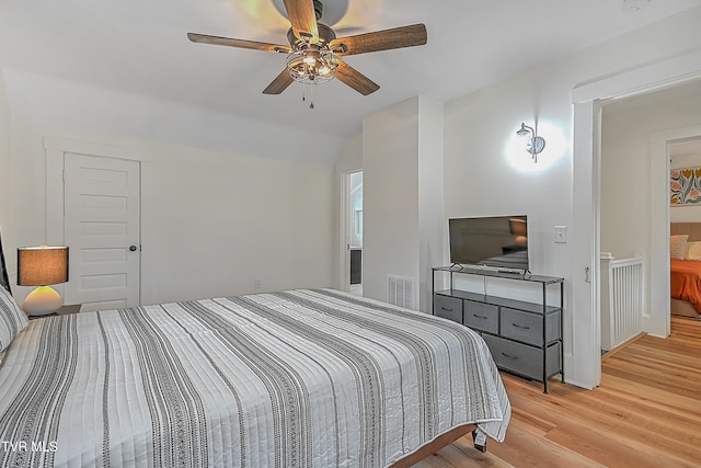 bedroom featuring ceiling fan and light hardwood / wood-style floors