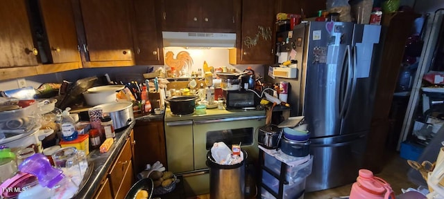 kitchen featuring stainless steel refrigerator