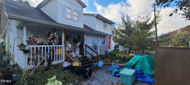 view of side of property with a porch