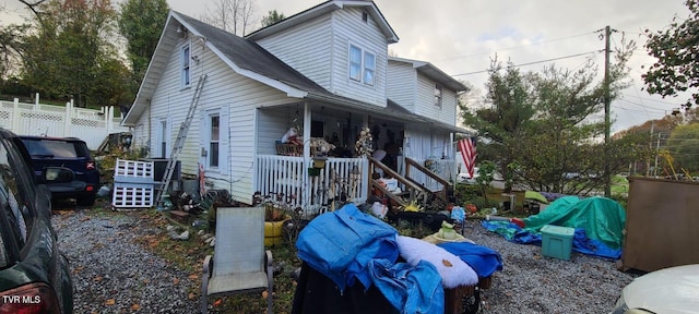 view of property exterior with a porch