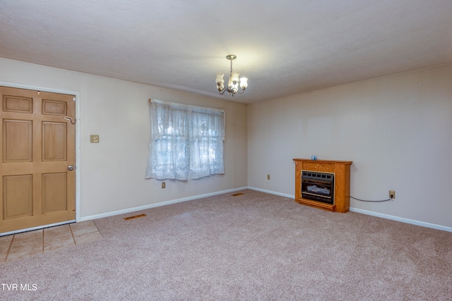 unfurnished living room with light colored carpet and a chandelier