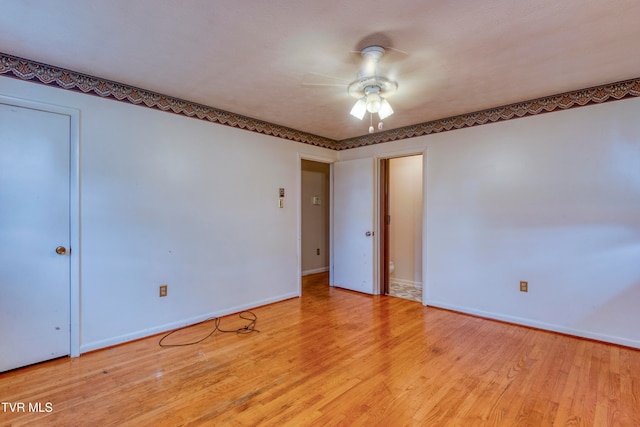 empty room featuring light hardwood / wood-style floors and ceiling fan