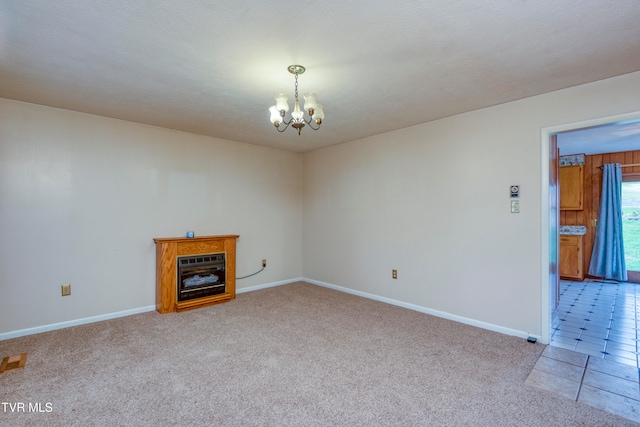 unfurnished living room with a textured ceiling, light tile patterned floors, and a notable chandelier