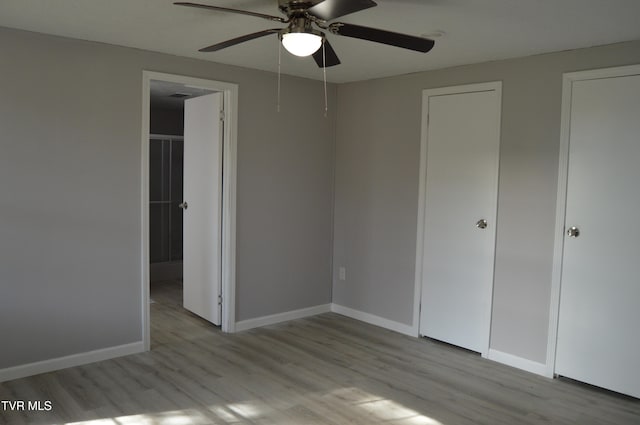 unfurnished bedroom featuring light hardwood / wood-style floors and ceiling fan