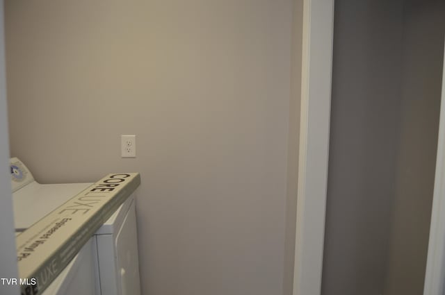 laundry room featuring washing machine and clothes dryer