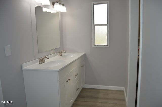 bathroom featuring hardwood / wood-style floors and vanity