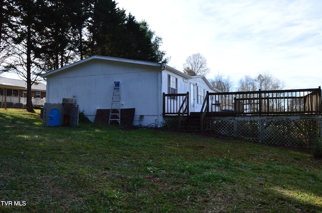 exterior space with a lawn and a deck