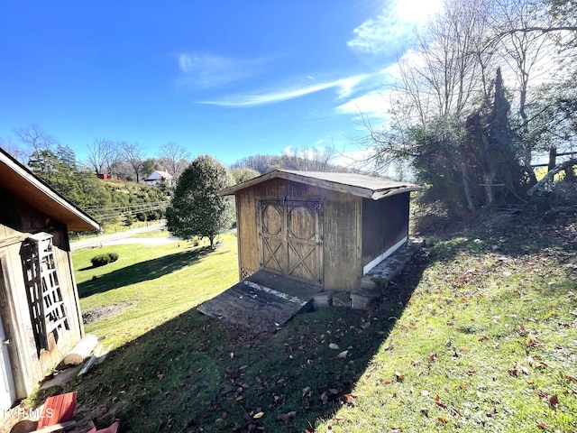 view of outbuilding featuring a lawn