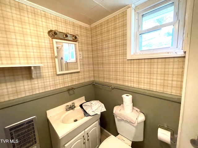 bathroom with vanity, toilet, and crown molding