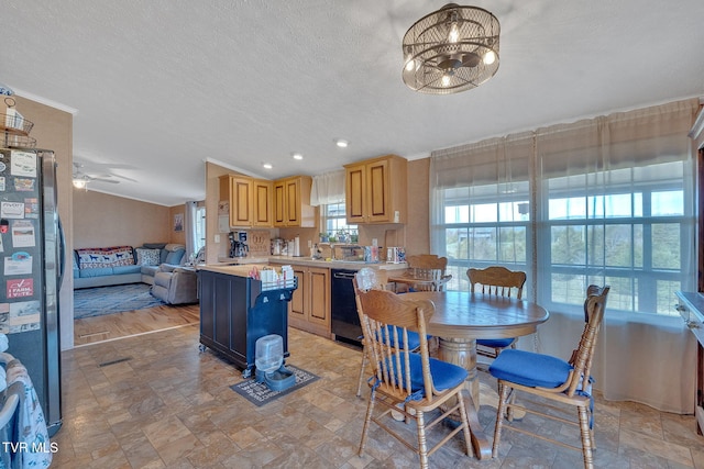 dining space with a textured ceiling, light wood-type flooring, ceiling fan, and crown molding