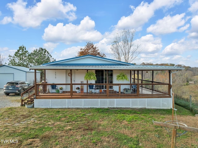 back of property featuring a yard