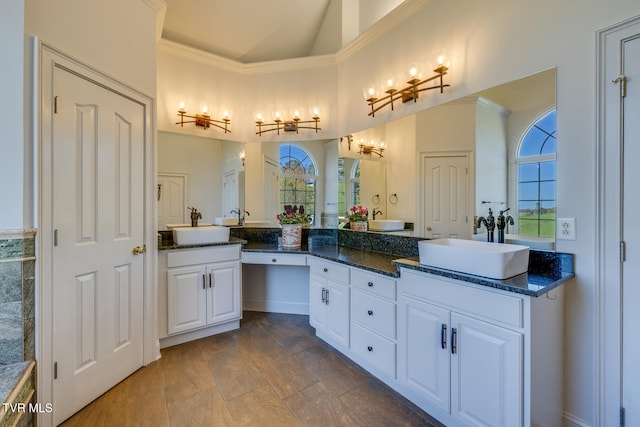 bathroom with vanity and ornamental molding