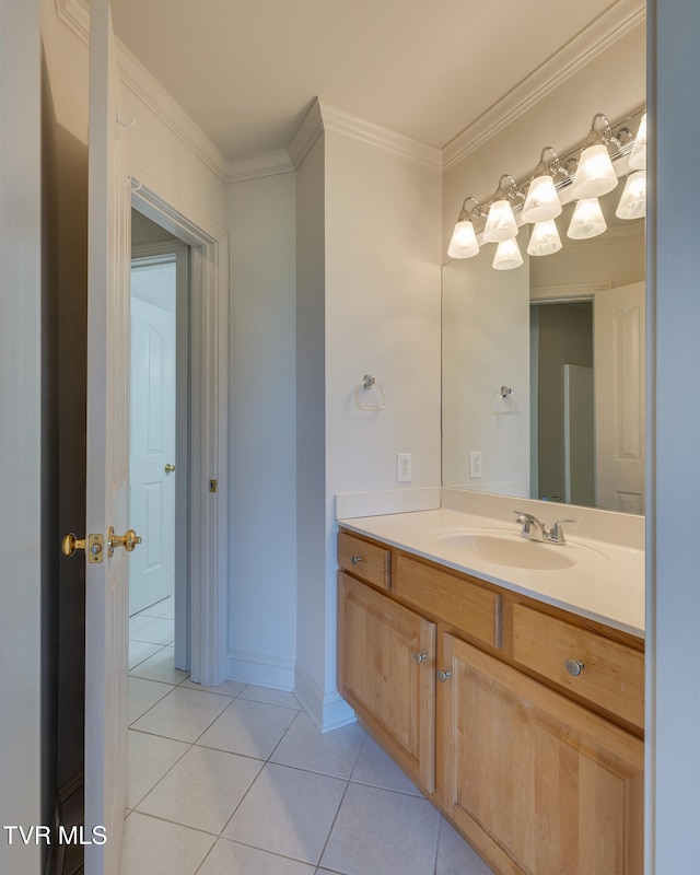 bathroom with vanity, tile patterned floors, and ornamental molding