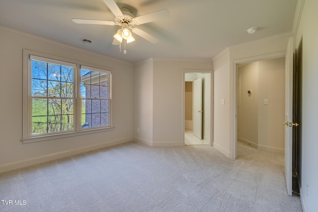 unfurnished bedroom featuring ornamental molding, light carpet, and ceiling fan