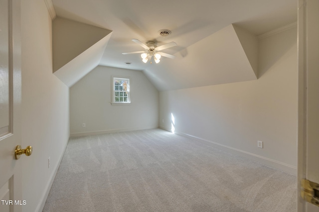 bonus room with light carpet, ceiling fan, and vaulted ceiling