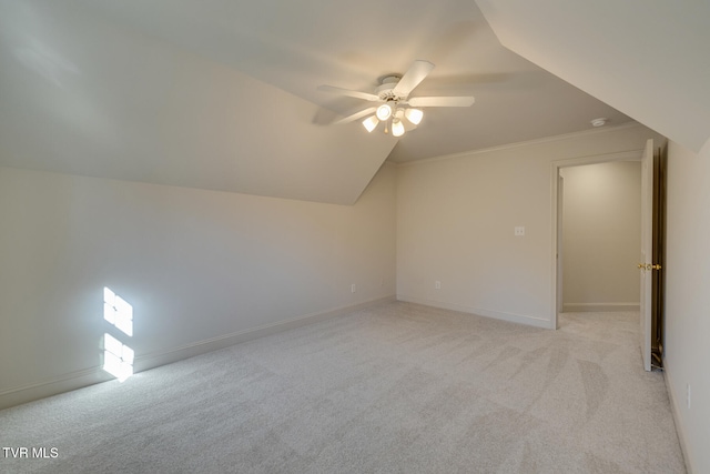 additional living space with ceiling fan, light carpet, and lofted ceiling