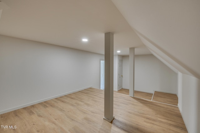 basement featuring light wood-type flooring