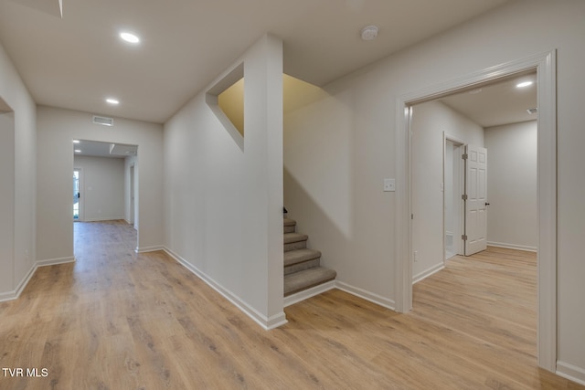 hallway with light wood-type flooring