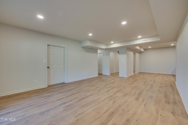 basement featuring light wood-type flooring