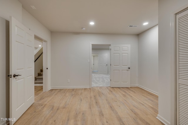 unfurnished bedroom with light wood-type flooring