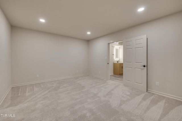 empty room featuring light colored carpet