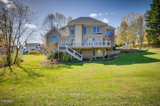 back of house featuring a deck and a yard