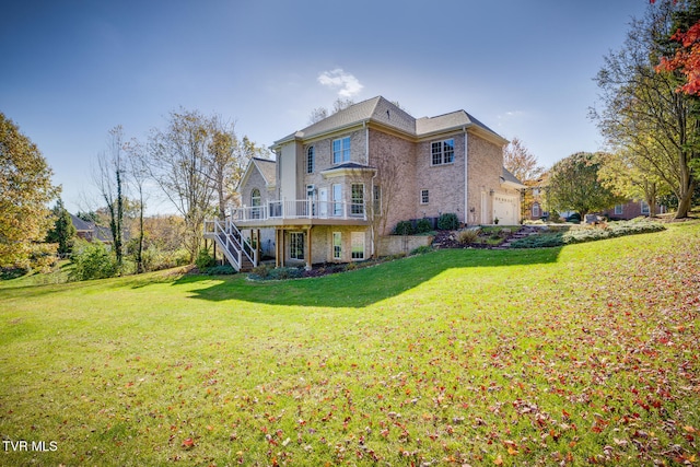 back of property featuring a garage, a wooden deck, and a yard