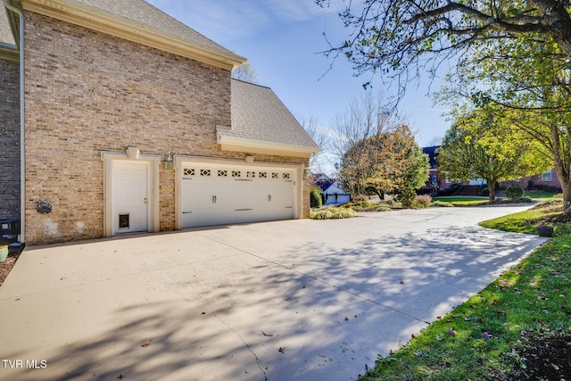 view of property exterior featuring a garage