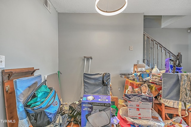 interior space with a textured ceiling