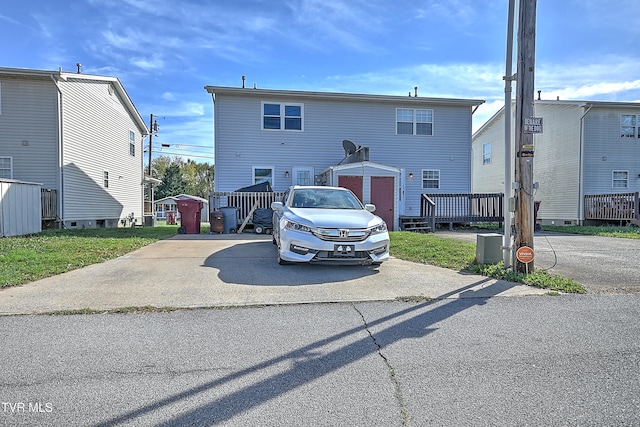 view of front of home with a storage shed