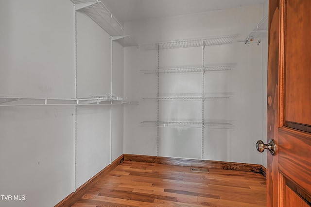 walk in closet featuring light wood-type flooring