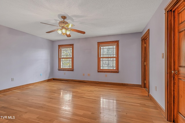 unfurnished bedroom with ceiling fan, light hardwood / wood-style floors, and a textured ceiling