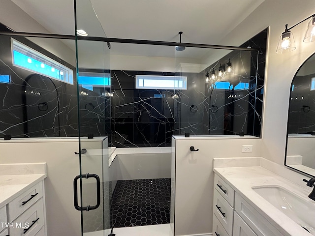 bathroom with vanity and an enclosed shower